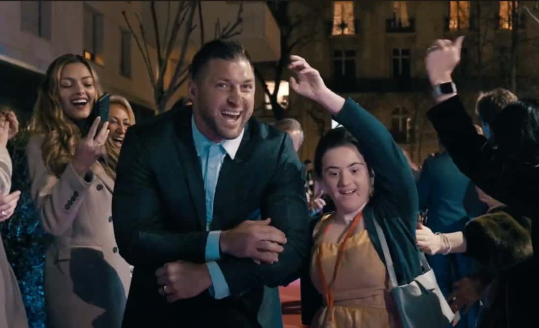 Tim Tebow escorting a Night to Shine Queen